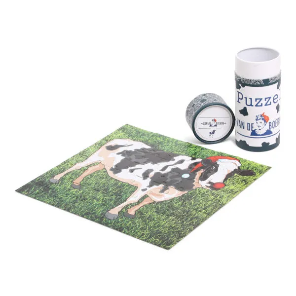 Kinderpuzzel in een ronde koker met boerin-thema